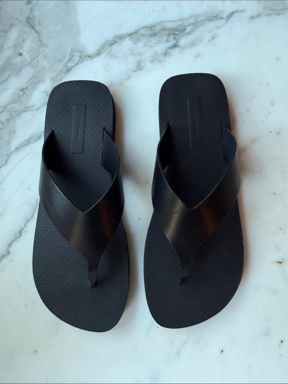 The Row Black Minimalist Flip Flop Sandals